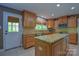 Bright kitchen featuring granite countertops, stainless steel appliances, and ample cabinet space at 106 Chatworth Ln, Mooresville, NC 28117
