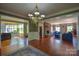 Open floor plan showcasing the dining room, living room, and sunroom, great for entertaining at 106 Chatworth Ln, Mooresville, NC 28117