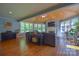 Bright sunroom featuring a vaulted ceiling, fireplace, and panoramic windows for ample natural light at 106 Chatworth Ln, Mooresville, NC 28117