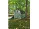 Backyard outbuilding nestled among mature trees in a serene setting at 10624 Wood Meadow Dr, Charlotte, NC 28227