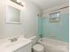 Cozy bathroom featuring a shower-tub combo, a vanity sink, and neutral tile at 1100 Clawson Ct, Charlotte, NC 28209
