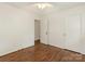 Bedroom featuring hardwood floors, ceiling fan, and neutral walls at 1100 Clawson Ct, Charlotte, NC 28209
