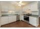 Well-lit kitchen boasts updated stainless steel appliances and neutral countertops at 1100 Clawson Ct, Charlotte, NC 28209