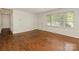 Inviting living room with hardwood floors and natural light streaming through the window at 1100 Clawson Ct, Charlotte, NC 28209