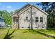 A cozy home with beige siding, bright windows, and a well-manicured lawn, perfect for comfortable living at 1101 Kenly St, Salisbury, NC 28144