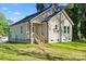 Charming single-story home with beige siding, a welcoming front porch, and a neatly maintained lawn at 1101 Kenly St, Salisbury, NC 28144