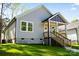 Charming single-story home featuring gray siding, a welcoming front porch and a well-maintained green lawn at 1101 Kenly St, Salisbury, NC 28144