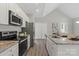 Modern kitchen features stainless steel appliances, granite countertops, and ample cabinet space at 1101 Kenly St, Salisbury, NC 28144