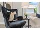 Living room featuring a black velvet armchair, side table with decor, and a comfortable seating arrangement at 1101 Kenly St, Salisbury, NC 28144