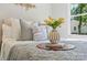 Bedroom features an elegant vase of tulips, soft pillows and a grey throw at 1103 Kenly St, Salisbury, NC 28144