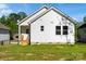 Exterior view of the home displaying the backyard, siding, and complementing the surrounding greenery at 1103 Kenly St, Salisbury, NC 28144