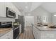 Modern kitchen features granite countertops, stainless steel appliances, and ample cabinet space at 1103 Kenly St, Salisbury, NC 28144