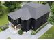 Rear exterior aerial featuring a home with a rear porch, patio, and dark exterior paint at 1115 West Blvd, Charlotte, NC 28208