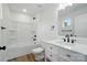 Modern bathroom featuring a white vanity with marble countertop and a shower-tub combo at 1118 Allman Ext, Mount Pleasant, NC 28124