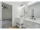 Bathroom with double sinks, granite countertop vanity, and entry to bedroom at 1118 Allman Ext, Mount Pleasant, NC 28124