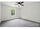 Bedroom featuring neutral colored carpet, ample natural light, and ceiling fan at 1118 Allman Ext, Mount Pleasant, NC 28124