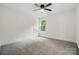 This bedroom features neutral colored carpet, ample natural light, and closet at 1118 Allman Ext, Mount Pleasant, NC 28124