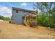 Back exterior of house with wood deck and landscaped yard at 1118 Allman Ext, Mount Pleasant, NC 28124