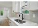 Close-up on a modern kitchen featuring stone countertops and stainless appliances at 1118 Allman Ext, Mount Pleasant, NC 28124