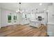 Bright kitchen features a large island, stainless steel appliances and wood flooring at 1118 Allman Ext, Mount Pleasant, NC 28124