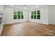 Large living room featuring hardwood floors, big windows, recessed lighting, and white walls at 1118 Allman Ext, Mount Pleasant, NC 28124