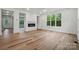 Bright living room with a fireplace and large windows providing lots of natural light at 1118 Allman Ext, Mount Pleasant, NC 28124