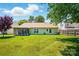 Expansive backyard with well-maintained lawn and partially screened porch at 118 Winborne Dr, Mooresville, NC 28115