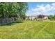 Large grassy backyard with mature trees and privacy fence at 118 Winborne Dr, Mooresville, NC 28115