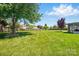 Spacious backyard featuring well-maintained lawn and mature shade trees at 118 Winborne Dr, Mooresville, NC 28115