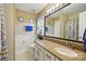 Bathroom with granite countertops, vanity, and decorative mirror at 118 Winborne Dr, Mooresville, NC 28115