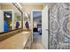 Bathroom with a view of a bedroom has decorative tile and shower curtain at 118 Winborne Dr, Mooresville, NC 28115