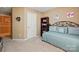 Tan bedroom featuring a daybed, a bookcase, and neutral carpeting for a cozy feel at 118 Winborne Dr, Mooresville, NC 28115