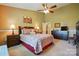 Large bedroom with ceiling fan, carpet, soft lighting, and large dresser for ample storage at 118 Winborne Dr, Mooresville, NC 28115