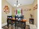A brightly lit dining area features a table with chairs, artwork, and a large window at 118 Winborne Dr, Mooresville, NC 28115