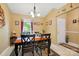 The dining area has a chandelier and a window with a birdhouse view of the outdoors at 118 Winborne Dr, Mooresville, NC 28115