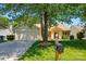 Single story home with mature shade tree, two car garage, well kept lawn and landscaping at 118 Winborne Dr, Mooresville, NC 28115