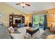 Spacious living room featuring comfortable seating, entertainment center, and sliding doors to backyard at 118 Winborne Dr, Mooresville, NC 28115