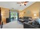 Inviting living room with comfortable seating, neutral carpet, and sliding glass doors to outdoor patio at 118 Winborne Dr, Mooresville, NC 28115