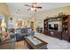 Comfortable living room with kitchen view, vaulted ceiling, and neutral carpet at 118 Winborne Dr, Mooresville, NC 28115