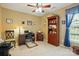 Bright office space featuring a wooden desk, chair, and bookshelf with natural light at 118 Winborne Dr, Mooresville, NC 28115
