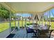 Enclosed patio sunroom with tile floor, a table and chairs, and backyard views at 118 Winborne Dr, Mooresville, NC 28115