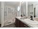 Bathroom featuring a double sink vanity, decorative shower curtain, and neutral walls at 119 Marietta Rd, Mooresville, NC 28117