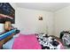 This bedroom features a wooden headboard with lights and a cow print blanket at 119 Marietta Rd, Mooresville, NC 28117