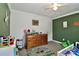 bedroom with green accent wall, carpet and white ceiling fan at 119 Marietta Rd, Mooresville, NC 28117