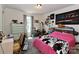 Bright bedroom featuring a cow print blanket and desk area at 119 Marietta Rd, Mooresville, NC 28117