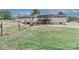 House exterior featuring a metal carport, gravel driveway, a fenced yard and landscaping at 119 Marietta Rd, Mooresville, NC 28117