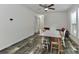 Dining room featuring hardwood floors, ceiling fan, with natural light from large windows at 119 Marietta Rd, Mooresville, NC 28117