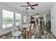 Dining area featuring an open layout to the kitchen, hardwood floors, with modern fixtures at 119 Marietta Rd, Mooresville, NC 28117