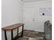 A clean entryway with a modern console table and stylish wood-look floors at 119 Marietta Rd, Mooresville, NC 28117