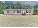 Welcoming single-story home features a simple facade and a neatly kept lawn, perfect for comfortable living at 119 Marietta Rd, Mooresville, NC 28117